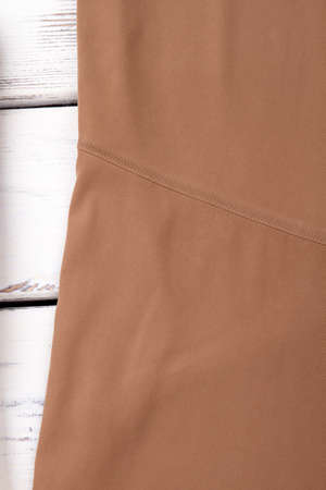 Close up female brown color skirt. Detail of beige classy skirt. Vintage classic apparel.の写真素材