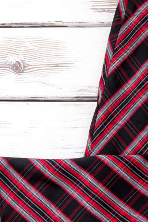 Female striped skirt and copy space. Women clothes on white wooden background. Warm female clothing on wooden table.の写真素材