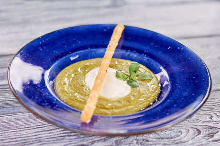 Spinach and celery cream soup. Delicious spinach and celery cream soup with poached egg and fresh...