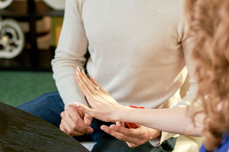 Hand of woman with a wedding ring.の写真素材