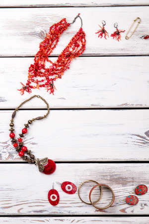 Layout of jewelry accessories. Set of bijouteries disposed around, cropepd vertical photo.の写真素材