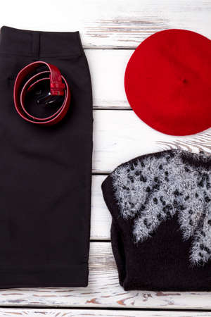 Winter clothing arrangement. White wooden desk background.の写真素材