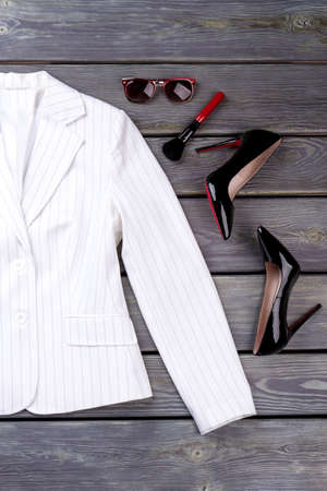 Stylish business clothes and accessories. Black wooden surface background.の写真素材