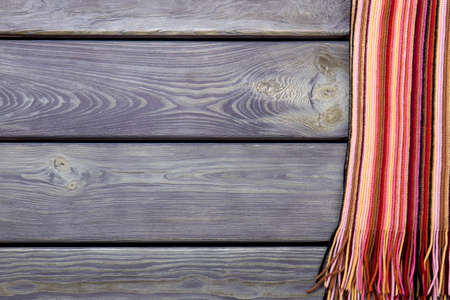 Close up striped wool clothes. Flat lay, top view. Black background.の写真素材