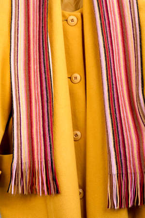 Close up winter cloth texture. Wooden desk surface background.の写真素材