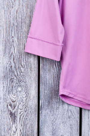 Close up silk purple clothes. Top macro view. Grey desk surface background.の写真素材