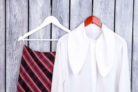 Flatlay women classy summer look. Close up, top view. Grey desk surface background.の写真素材