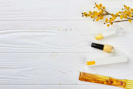 Make up products and copy space. Decorative flat lay composition with cosmetics and spring plant. Happy Womans Day.の写真素材