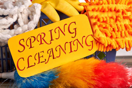 Spring cleaning colorful background. Spring cleaning concept with supplies. Paper card with text...