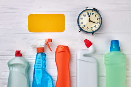 House cleaning supplies on wooden background. House cleaning equipment on wooden table. Clean your home with cleaning service.の写真素材