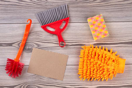 House cleaning items on wooden background. House cleaning supplies. Preparation for spring cleaning.の写真素材