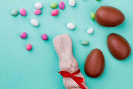 Delicious Easter eggs and rabbit. Beautiful composition with white chocolate rabbit and colorful...