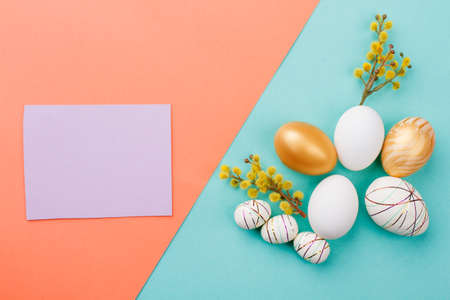 Delicate Easter composition and blank paper. Easter decor elements and card with copy space. Spring...