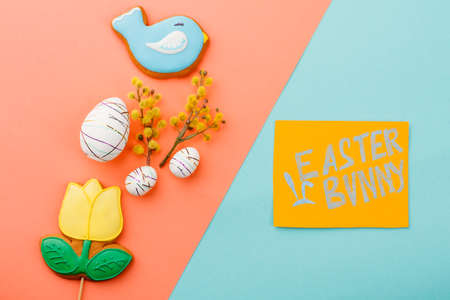 Easter festive background with cookies. Easter bunny inscription on paper card. Easter festive background.の写真素材