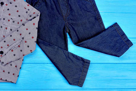 Close up of jeans and shirt for baby-boy. Toddler boys denim apparel for spring or autumn, top view.の写真素材
