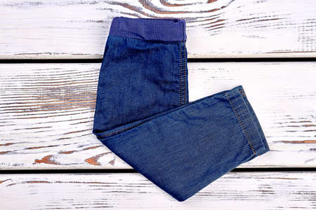 Kids new folded jean trousers. Baby high quality jeans on sale. Kids boutique clothes. Casual kids denim.の写真素材