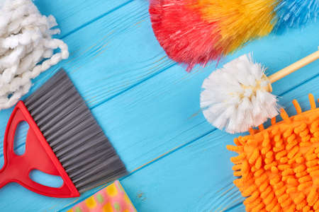 Assorted cleaning products, copy space. Household staff on blue wooden background. Clean home is the best home.の写真素材