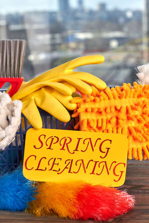 Equipment for house cleaning close up. House cleaning products including gloves and duster. Make your home better with our service.の写真素材