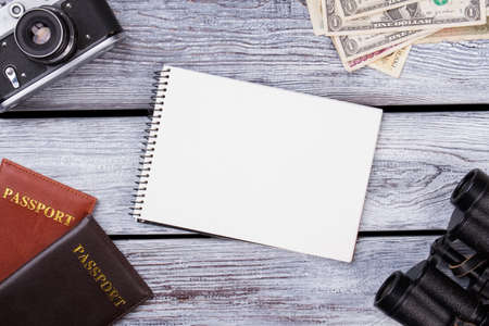 Passport travel concept and blank notepad. Flat lay design of work desk Planning with plane.