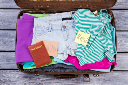 Womens clothes and accessories. Rest and vacation concept. Passport and mail, flat lay top view.