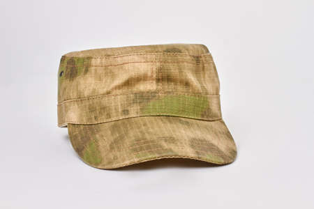 Military cap with khaki color. Front view. White isolated background.
