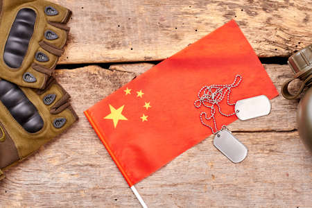 China army soldier essentials arrangement. Top view, flat lay. Wooden background.の写真素材