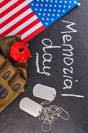US army vetaran soldier's attributes for memorial day. Black leather background.の写真素材