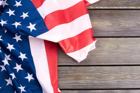 American flag and text space. USA patriotic flag on wooden background and copy space. Memorial Day...