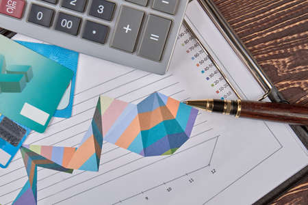 Financial accounting concept. Calculator, clip board, credit cards and pen.