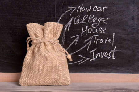 Money canvas bag. Purposes for saving money concept.の写真素材