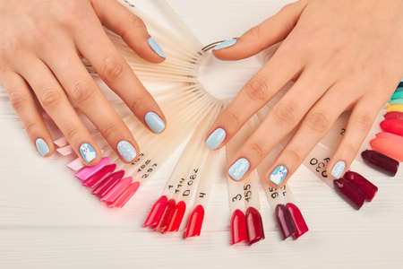 Manicured hands and nails color palette. Gentle winter manicure and hand-pinted nail samples....