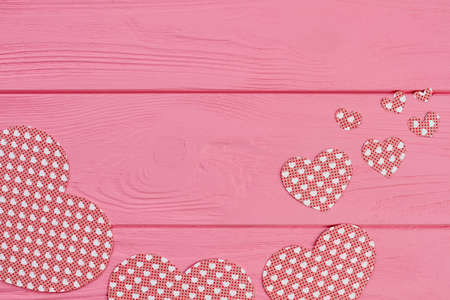 Collection of paper hearts on wooden background. Set of handmade paper cutouts for Valentines Day and copy space. Valentines holiday greeting card.の写真素材