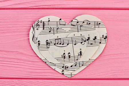 Collection of paper hearts with musical notes. Music love background.