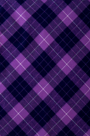 Checkered woolen clothes material texture. Vertical cropped view, pattern of lines.の写真素材