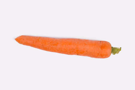 Fresh carrot on white background. Close up. One single orange carrot isolated on white.の写真素材