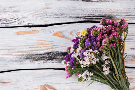 Bunch of flowers on wood. The beautiful lilac on a wooden background.の写真素材