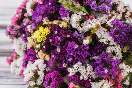 Blooming lilac flowers close up. Purple, white and yellow little flowers.