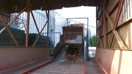 Truck with empty trail in a grain factory warehouse. Storage facility.