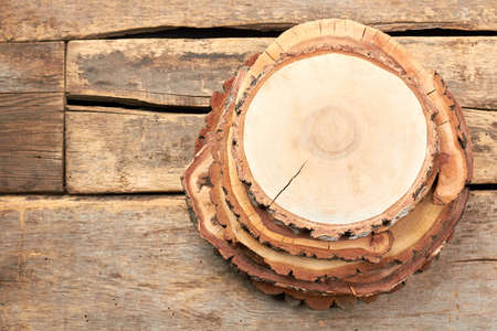 Natural wooden discs, top view. Round wooden discs for decor. Rustic wedding centerpiece.の写真素材