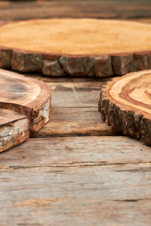 Wood round slice and copy space. Rustic wooden discs, cropped image. Vintage wooden background.