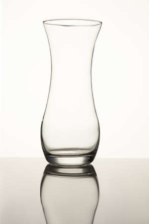Clear glass vase isolated on a white background. Close up. Empty glass.の写真素材