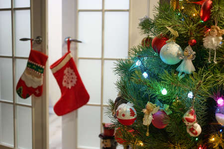 Beautifully decorated Christmas tree. Christmas or New Year interior decor. Winter holidays room.