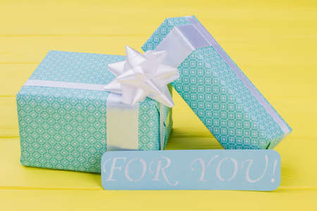 Valentines Day gift boxes on color background. Romantic background with gift boxes. Birthday or anniversary concept.の写真素材