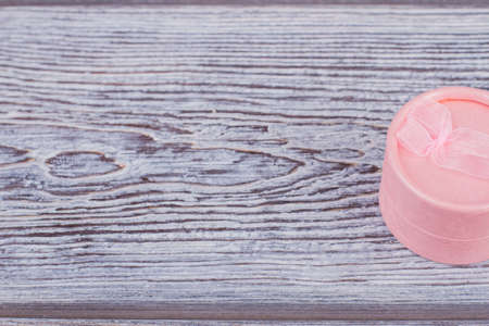 Pink jewelry gift box with copy space. Jewelry paper box in a shape of tube. Jewelry box design.の写真素材