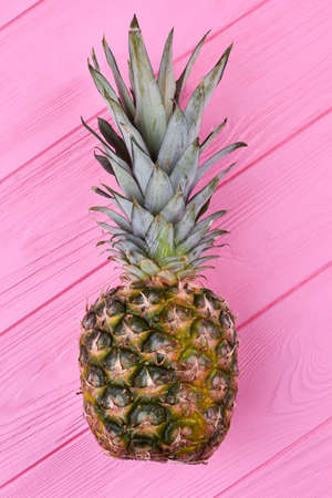 Healthy nutritious pineapple fruit on color wooden background.の写真素材