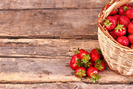 Sweet tasty strawberries on rustic wooden background.の写真素材