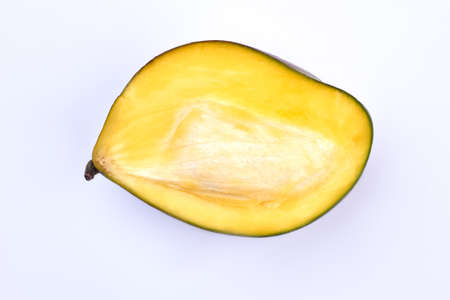 Half of ripe mango on white background.