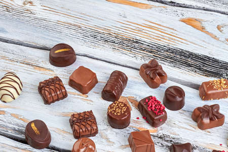 Collection of delicious candies on light wooden boards.の写真素材