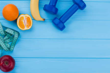Fitness equipment, fruits and copy space. Healthy eating, sport and beauty concept. How to lose weight fast.の写真素材