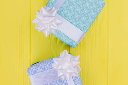 Gift boxes on color background. Beautiful present boxes, top view. Holiday concept.